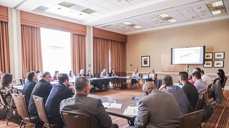 Agents around the table at a Club Wealth coaching mastermind
